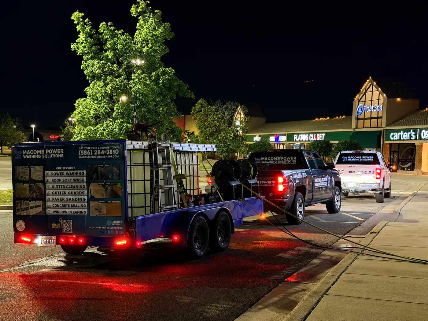 Macomb Power Washing Solutions rig working a commercial plaza at night